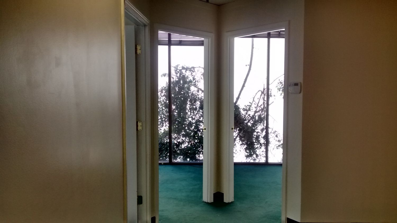 TILE ENTRY AND RECEPTION, 3 OFFICES AND LARGER ROOM.